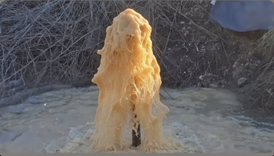 Water before FuturFlo treatment — discolored with bicarbonate buildup